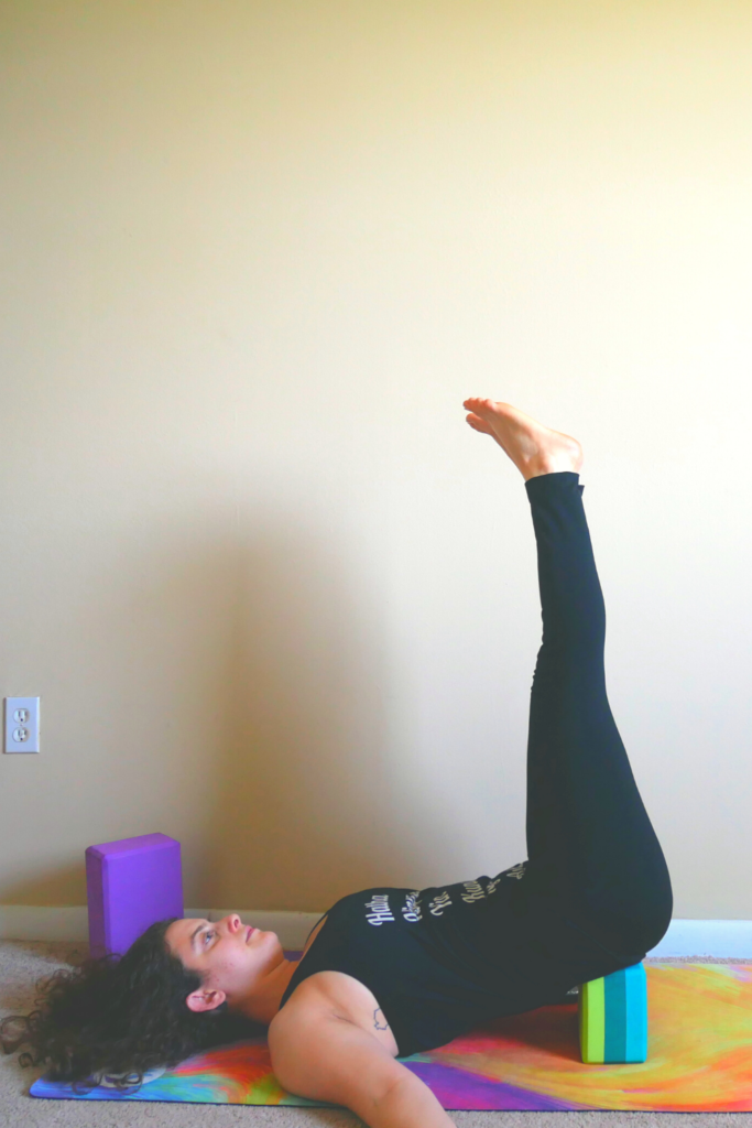 legs up the wall with a yoga block — Tamara Fayad Yoga